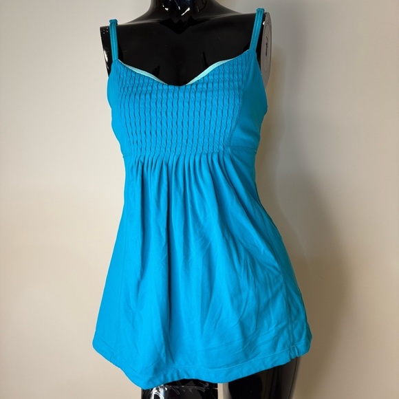 lululemon athletica Tops - Lululemon Aqua Blue Smocked Babydoll Tank Built in Bra – Size 8